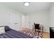Well-lit bedroom with a closet, desk, and natural light, offering a functional and inviting space at 3841 Meridee Dr, Indianapolis, IN 46237
