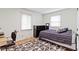 Comfortable bedroom with a cozy bed, geometric rug, and natural light, offering a relaxing and inviting space at 3841 Meridee Dr, Indianapolis, IN 46237