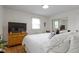 Comfortable bedroom features natural light and ample storage, creating a tranquil and inviting atmosphere at 3841 Meridee Dr, Indianapolis, IN 46237