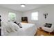 Relaxing bedroom with two windows, a queen bed, and a cozy sitting chair, perfect for rest and rejuvenation at 3841 Meridee Dr, Indianapolis, IN 46237
