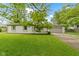 Charming single-story home with a well-manicured lawn and an attached two car garage at 3841 Meridee Dr, Indianapolis, IN 46237