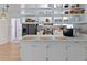 Bright kitchen featuring white cabinetry, stainless steel appliances, and open shelving at 3841 Meridee Dr, Indianapolis, IN 46237