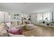 Bright and inviting living room showcases comfortable seating, shelving, and an open view to the kitchen at 3841 Meridee Dr, Indianapolis, IN 46237