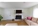 A cozy living room offers a fireplace, plush seating, and plenty of natural light, perfect for relaxing or entertaining at 3841 Meridee Dr, Indianapolis, IN 46237