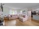 Spacious living room offers plush seating, a large window, and easy access to the adjacent kitchen area at 3841 Meridee Dr, Indianapolis, IN 46237