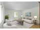 Bright and airy living room with neutral colors and comfortable seating, a window, and artwork at 3841 Meridee Dr, Indianapolis, IN 46237