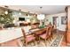 Elegant dining room features hardwood floors, a decorative rug, and a stylish chandelier at 392 Sandbrook Dr, Noblesville, IN 46062