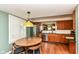 Charming eat-in kitchen with wood cabinets, stainless steel appliances, and lots of natural light at 392 Sandbrook Dr, Noblesville, IN 46062