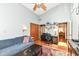 Relaxing living area featuring a comfortable blue couch, vaulted ceilings, and skylight at 392 Sandbrook Dr, Noblesville, IN 46062