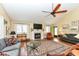 Bright living room features an inviting fireplace, neutral paint, and lots of natural light at 392 Sandbrook Dr, Noblesville, IN 46062