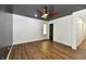 Bright bedroom featuring a modern ceiling fan, wood floors, and an ample amount of natural light at 4115 Tansel Rd, Indianapolis, IN 46234