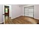This bedroom features wood-look floors, neutral walls and a closet with shelving at 4115 Tansel Rd, Indianapolis, IN 46234