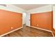 This bedroom features wood-look floors, neutral walls and a door to the rest of the house at 4115 Tansel Rd, Indianapolis, IN 46234