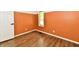 This bedroom features wood-look floors, neutral walls and a window to provide lots of natural light at 4115 Tansel Rd, Indianapolis, IN 46234