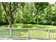 Inviting backyard wooden deck with railing, providing a serene view of the lush lawn at 4115 Tansel Rd, Indianapolis, IN 46234