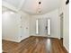 Bright foyer with wood flooring, a modern light fixture, and a door with sidelights at 4115 Tansel Rd, Indianapolis, IN 46234