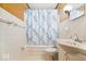 A bright bathroom featuring white tile and vintage-style fixtures at 414 S Green St, Brownsburg, IN 46112