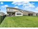 Spacious backyard with lush green grass and a covered patio, perfect for outdoor entertaining at 4250 Blackford Rd, Bargersville, IN 46106