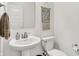 Cozy bathroom featuring a pedestal sink and decorative wall hanging at 4250 Blackford Rd, Bargersville, IN 46106