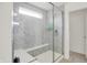 Luxurious bathroom with a spacious glass-enclosed shower featuring marble tiles, a built-in bench, and modern fixtures at 4250 Blackford Rd, Bargersville, IN 46106