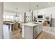 Modern open-concept kitchen featuring a large island, stainless steel appliances, and pendant lighting at 4250 Blackford Rd, Bargersville, IN 46106