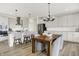Modern kitchen features stainless steel appliances, island seating, and pendant lights at 4250 Blackford Rd, Bargersville, IN 46106