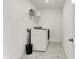 Laundry room with white marble floor and white washer and dryer at 4250 Blackford Rd, Bargersville, IN 46106