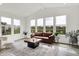 Inviting living room with large windows offering serene views of the lake at 4250 Blackford Rd, Bargersville, IN 46106