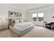Serene main bedroom featuring a plush bed, modern art, and backyard views at 4250 Blackford Rd, Bargersville, IN 46106
