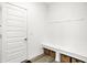 Organized mudroom with a built-in bench, storage baskets, and white trim at 4250 Blackford Rd, Bargersville, IN 46106
