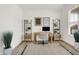 Well-lit home office featuring a wooden desk, modern shelving, and stylish decor for a productive workspace at 4250 Blackford Rd, Bargersville, IN 46106