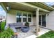 Inviting covered patio with comfortable seating around a modern fire pit, ideal for outdoor entertaining at 4250 Blackford Rd, Bargersville, IN 46106