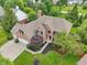 Aerial view of brick home with well-kept landscaping, three car garage, and proximity to green spaces at 427 Quincy Pl, Westfield, IN 46074