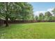 Large backyard with green grass and a tall wood fence at 427 Quincy Pl, Westfield, IN 46074
