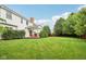Lush backyard features a well-maintained lawn and covered patio seating, a relaxing space for outdoor enjoyment at 427 Quincy Pl, Westfield, IN 46074