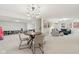 Open finished basement featuring a dining table, and lounge with blue sectional couch at 427 Quincy Pl, Westfield, IN 46074