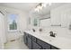 Bathroom featuring double sinks with updated black hardware, white countertops, and natural light at 427 Quincy Pl, Westfield, IN 46074