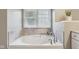 Comfortable bathroom features a soaking tub with tile surround, and brushed nickel fixtures at 427 Quincy Pl, Westfield, IN 46074