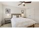 Light-filled bedroom featuring a neutral color palette, ceiling fan, and double door closet at 427 Quincy Pl, Westfield, IN 46074