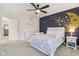 bedroom featuring a playful accent wall with moon and stars, and white furniture at 427 Quincy Pl, Westfield, IN 46074