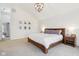 Bright bedroom featuring shiplap wall, neutral carpet, and modern light fixture at 427 Quincy Pl, Westfield, IN 46074