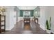 Dining room boasts a large table, modern lighting, and wainscotting at 427 Quincy Pl, Westfield, IN 46074