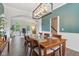 Open dining room adjacent to a home office and foyer features modern lighting at 427 Quincy Pl, Westfield, IN 46074