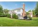 Exterior elevation of backyard with white siding, brick, a covered patio, and multiple spaces at 427 Quincy Pl, Westfield, IN 46074