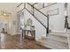 Spacious foyer with hardwood floors, staircase and access to living areas at 427 Quincy Pl, Westfield, IN 46074