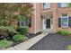 Elegant front entry featuring a modern door and professionally landscaped garden beds at 427 Quincy Pl, Westfield, IN 46074