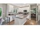 Well-lit kitchen with white cabinets, granite countertops, a center island, and modern appliances at 427 Quincy Pl, Westfield, IN 46074