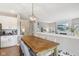Eat-in kitchen with stainless appliances, hardwood floors, and an open design into the living area at 427 Quincy Pl, Westfield, IN 46074