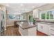 The kitchen features stainless steel appliances, granite counters, and an island with seating at 427 Quincy Pl, Westfield, IN 46074