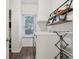 Bright laundry room with modern washer and dryer and convenient shelving for storage at 427 Quincy Pl, Westfield, IN 46074